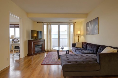 1406-683 10 Street Sw, Calgary, AB - Indoor Photo Showing Living Room With Fireplace