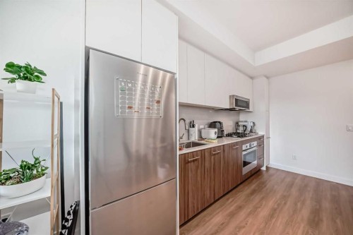 1313-730 2, Calgary, AB - Indoor Photo Showing Kitchen With Stainless Steel Kitchen