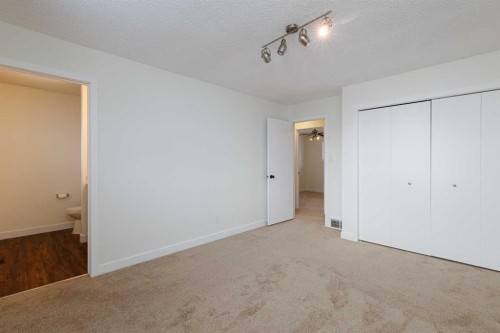 256 Queen Tamara Way Se, Calgary, AB - Indoor Photo Showing Other Room