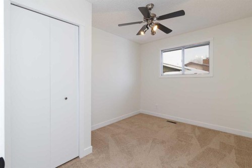 256 Queen Tamara Way Se, Calgary, AB - Indoor Photo Showing Other Room