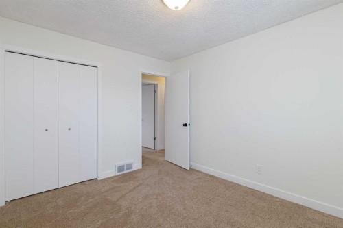 256 Queen Tamara Way Se, Calgary, AB - Indoor Photo Showing Other Room
