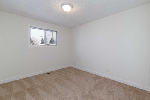 256 Queen Tamara Way Se, Calgary, AB - Indoor Photo Showing Other Room