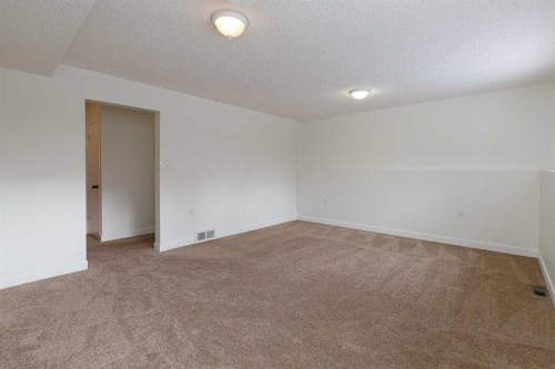 256 Queen Tamara Way Se, Calgary, AB - Indoor Photo Showing Other Room