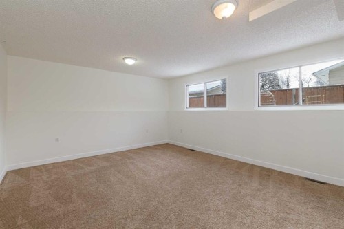 256 Queen Tamara Way Se, Calgary, AB - Indoor Photo Showing Other Room