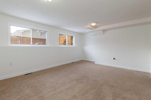 256 Queen Tamara Way Se, Calgary, AB - Indoor Photo Showing Other Room