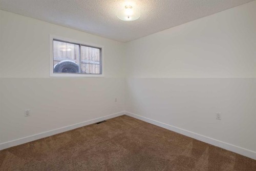 256 Queen Tamara Way Se, Calgary, AB - Indoor Photo Showing Other Room