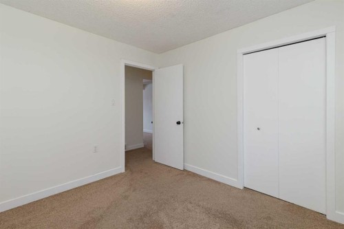 256 Queen Tamara Way Se, Calgary, AB - Indoor Photo Showing Other Room