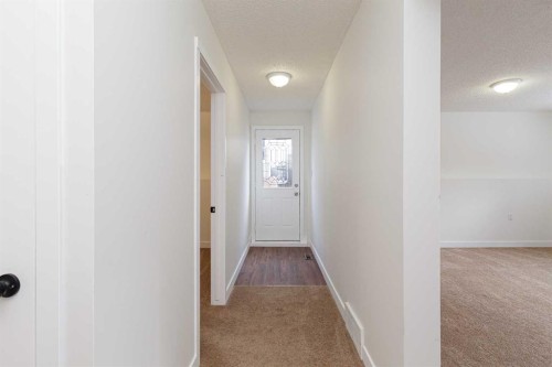 256 Queen Tamara Way Se, Calgary, AB - Indoor Photo Showing Other Room