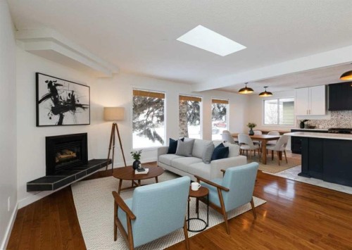 256 Queen Tamara Way Se, Calgary, AB - Indoor Photo Showing Living Room With Fireplace
