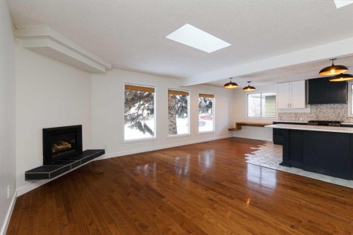 256 Queen Tamara Way Se, Calgary, AB - Indoor With Fireplace