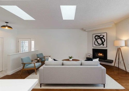 256 Queen Tamara Way Se, Calgary, AB - Indoor Photo Showing Living Room With Fireplace