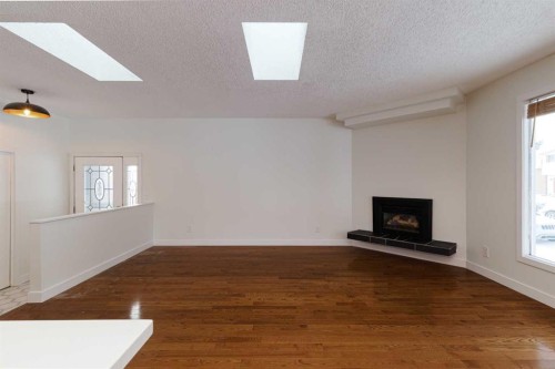 256 Queen Tamara Way Se, Calgary, AB - Indoor With Fireplace