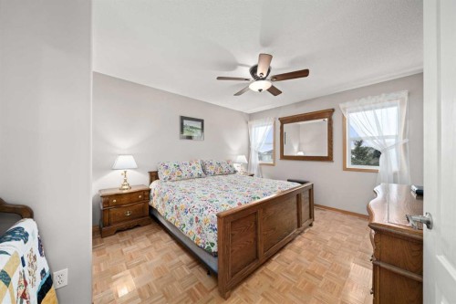 113 Sheep River Drive, Okotoks, AB - Indoor Photo Showing Bedroom