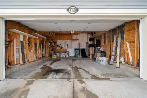 113 Sheep River Drive, Okotoks, AB - Indoor Photo Showing Garage