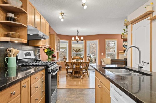 113 Sheep River Drive, Okotoks, AB - Indoor Photo Showing Kitchen With Double Sink