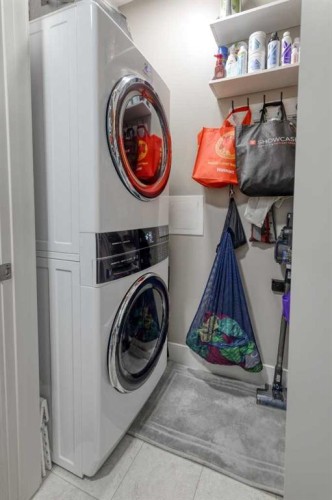 116-77 George Fox Trail, Cochrane, AB - Indoor Photo Showing Laundry Room