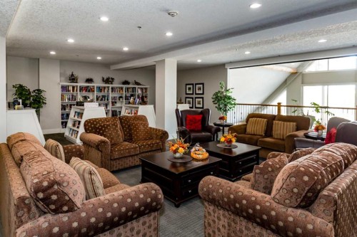 116-77 George Fox Trail, Cochrane, AB - Indoor Photo Showing Living Room