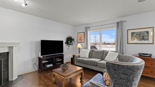 166 Bridlecrest Boulevard Sw, Calgary, AB - Indoor Photo Showing Living Room With Fireplace