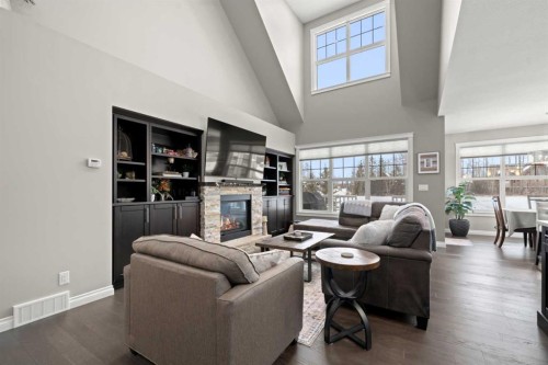 555 Summer Crescent, Rural Ponoka County, AB - Indoor Photo Showing Living Room With Fireplace