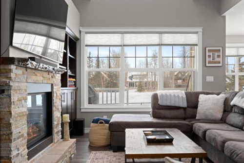 555 Summer Crescent, Rural Ponoka County, AB - Indoor Photo Showing Living Room With Fireplace