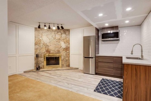 820 Cantrell Place Sw, Calgary, AB - Indoor With Fireplace