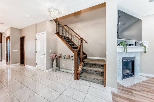 36 Red Embers Row Ne, Calgary, AB - Indoor Photo Showing Other Room With Fireplace