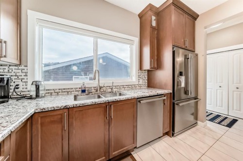 36 Red Embers Row Ne, Calgary, AB - Indoor Photo Showing Kitchen With Stainless Steel Kitchen With Double Sink With Upgraded Kitchen