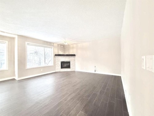 161 Springbank Place Sw, Calgary, AB - Indoor Photo Showing Living Room With Fireplace