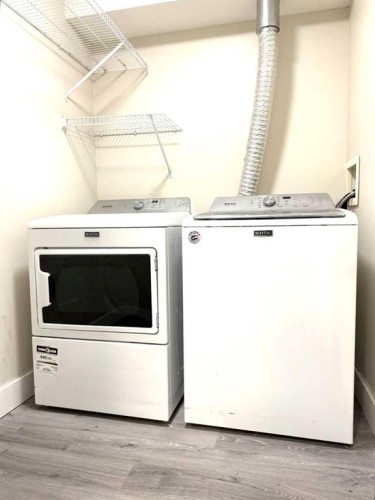 207-5555 Falsbridge Drive Ne, Calgary, AB - Indoor Photo Showing Laundry Room