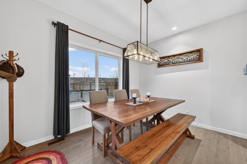 73 Fireside Cove, Cochrane, AB - Indoor Photo Showing Dining Room