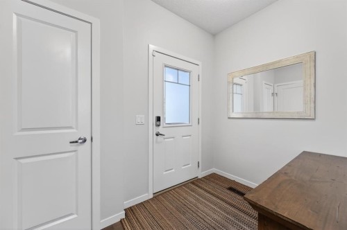 73 Fireside Cove, Cochrane, AB - Indoor Photo Showing Other Room