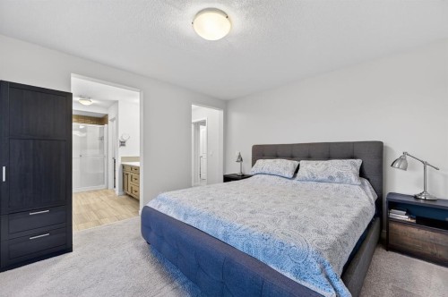 73 Fireside Cove, Cochrane, AB - Indoor Photo Showing Bedroom