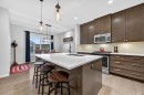 73 Fireside Cove, Cochrane, AB  - Indoor Photo Showing Kitchen With Stainless Steel Kitchen With Double Sink With Upgraded Kitchen 