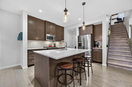73 Fireside Cove, Cochrane, AB - Indoor Photo Showing Kitchen With Stainless Steel Kitchen With Upgraded Kitchen