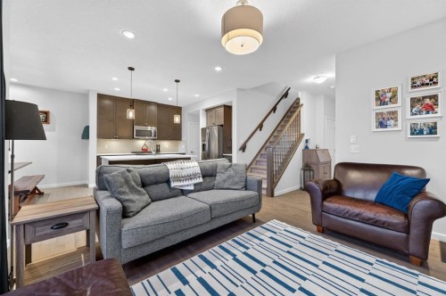 73 Fireside Cove, Cochrane, AB - Indoor Photo Showing Living Room