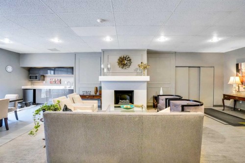 9E-133 25 Avenue Sw, Calgary, AB - Indoor With Fireplace