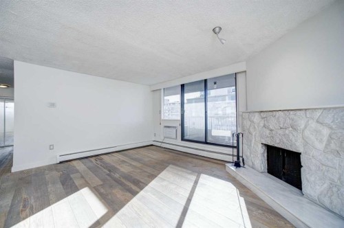 9E-133 25 Avenue Sw, Calgary, AB - Indoor Photo Showing Other Room With Fireplace