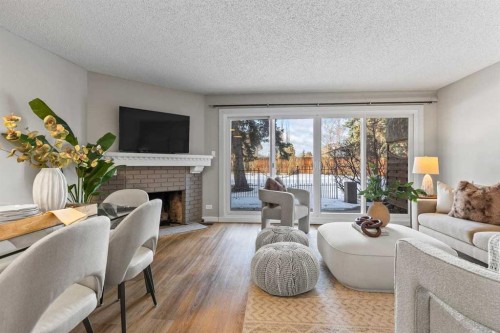 3-2212 Paliswood Road Sw, Calgary, AB - Indoor Photo Showing Living Room With Fireplace