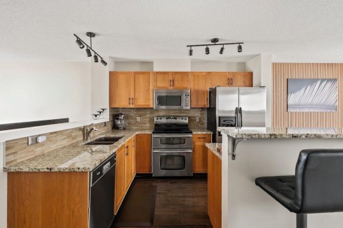 149 Elgin Gardens Se, Calgary, AB - Indoor Photo Showing Kitchen With Stainless Steel Kitchen With Double Sink