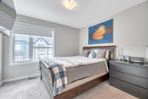 207-850 Belmont Drive Sw, Calgary, AB - Indoor Photo Showing Bedroom