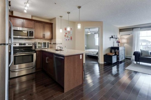 306-406 Cranberry Park Se, Calgary, AB - Indoor Photo Showing Kitchen With Double Sink