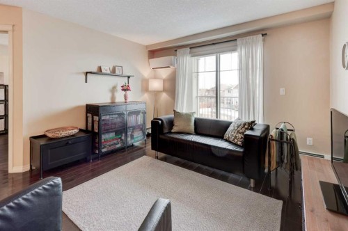 306-406 Cranberry Park Se, Calgary, AB - Indoor Photo Showing Living Room