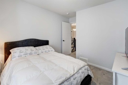 785 Windrow Manor Sw, Airdrie, AB - Indoor Photo Showing Bedroom