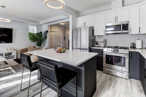 785 Windrow Manor Sw, Airdrie, AB - Indoor Photo Showing Kitchen With Upgraded Kitchen