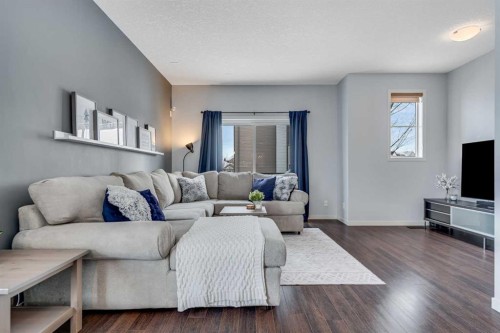 335 Copperpond Row Se, Calgary, AB - Indoor Photo Showing Living Room