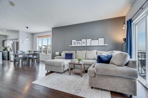 335 Copperpond Row Se, Calgary, AB - Indoor Photo Showing Living Room