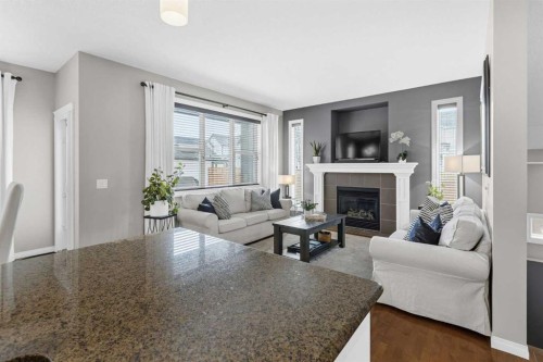 101 Evanscreek Court Nw, Calgary, AB - Indoor Photo Showing Living Room With Fireplace
