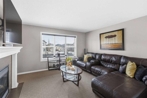 101 Evanscreek Court Nw, Calgary, AB - Indoor Photo Showing Living Room With Fireplace