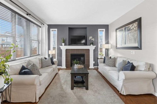 101 Evanscreek Court Nw, Calgary, AB - Indoor Photo Showing Living Room With Fireplace