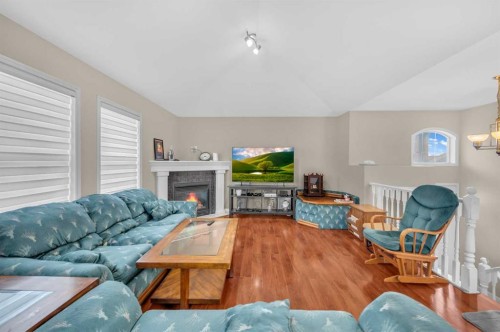 212 Tarawood Place Ne, Calgary, AB - Indoor Photo Showing Living Room With Fireplace